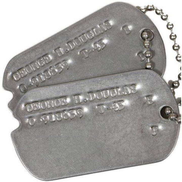 The officer had dog tags and what appeared to be a bullet casing around his neck. His mother is believed to be beside him, followed by his wife