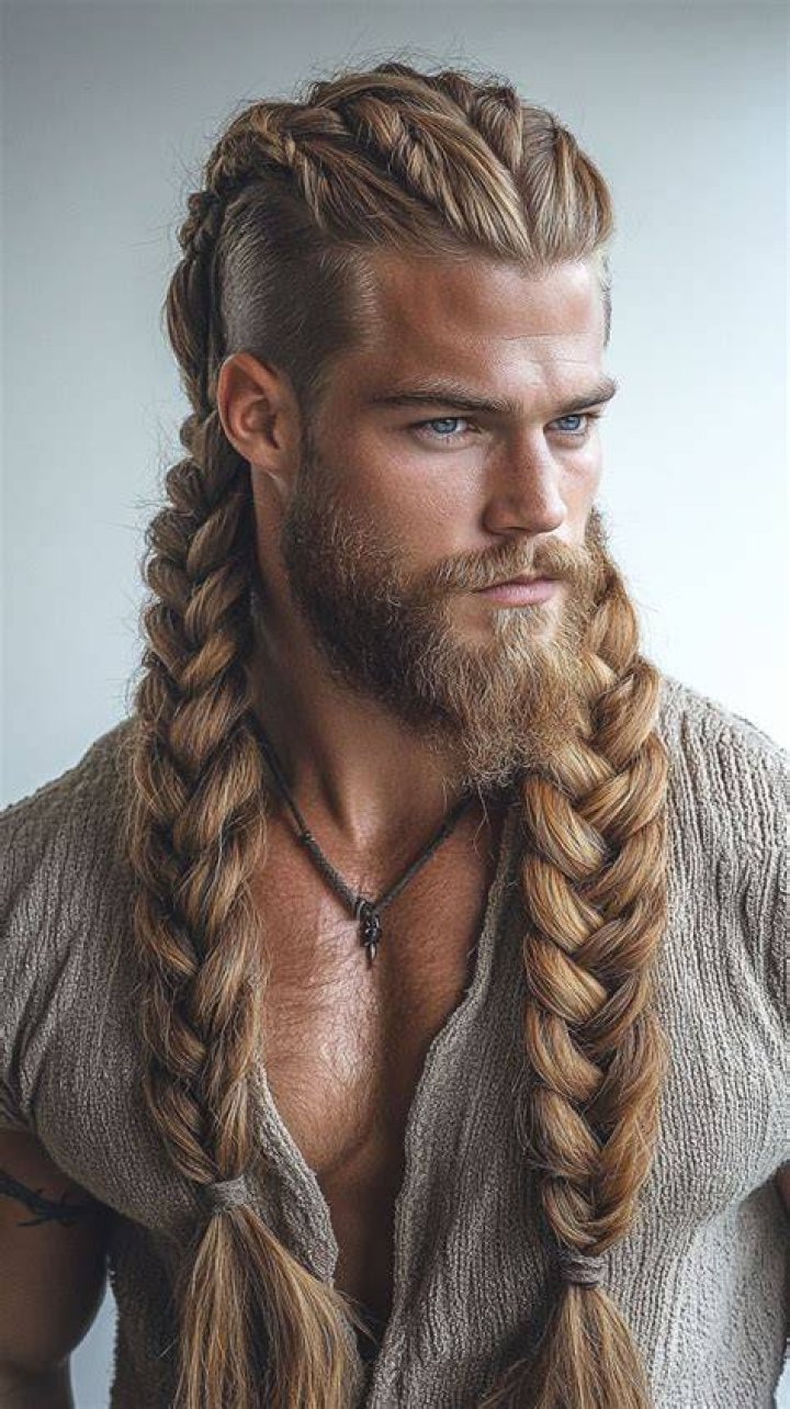 viking braids, two long braids, in front of the face, man with black